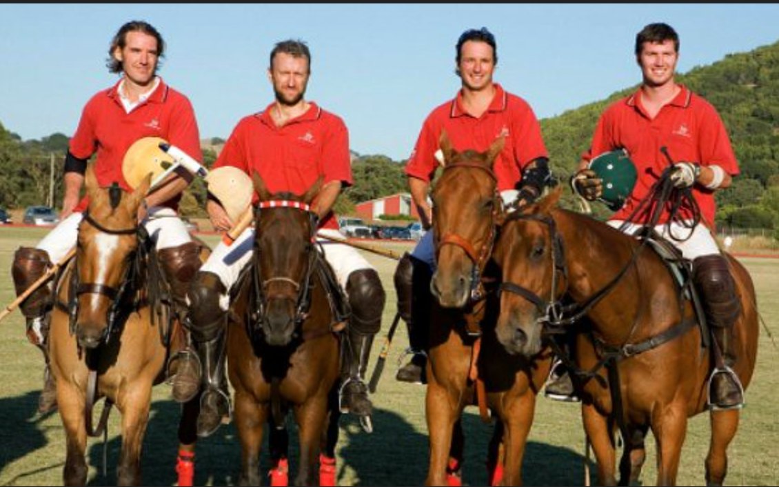 Four polo players in red shirts on horseback; JP Thieriot on the far left, Tim Parsa second from left